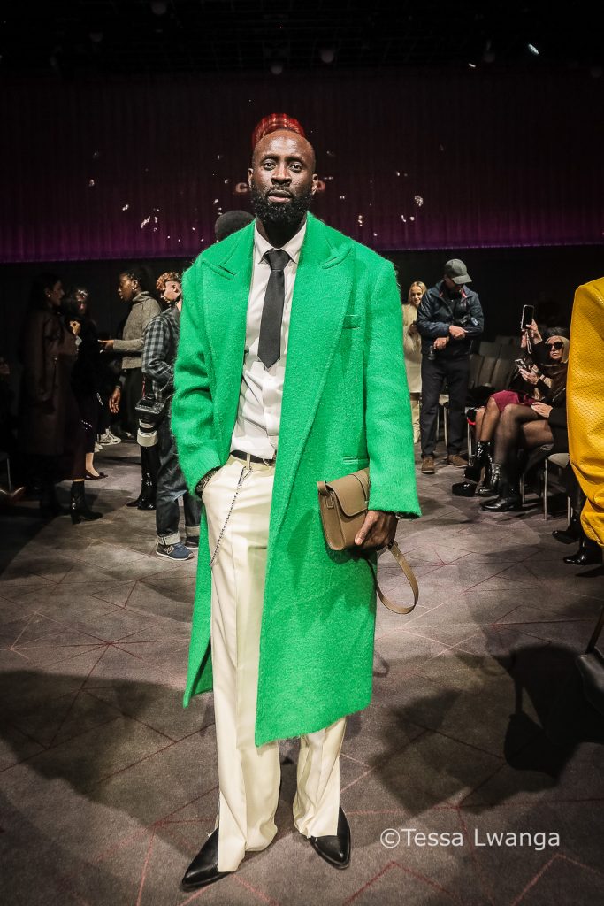 LFWAW25-1224 French celebrity designer Marcel Badiane-Robin, in green coat at London Fashion Week.
