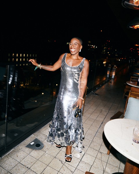Photo of writer in silver sequined dress.
